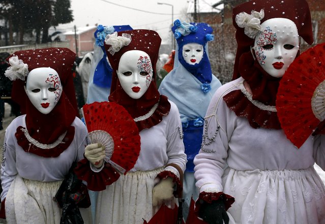 Revellers participate in a parade on the street during a carnival in the village of Vevcani, south of the Macedonian capital of Skopje, January 13, 2016. (Photo by Ognen Teofilovski/Reuters)