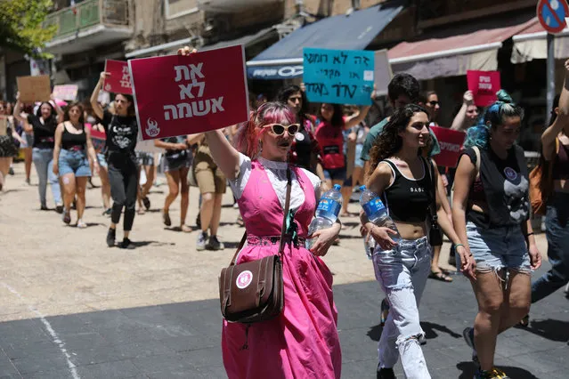 Israeli women march to protest against sexual harassment during the sl*t Walk rally in Jerusalem, Israel, 18 June 2021. The SlutWalk is a movement calling for an end to rape culture, including shamig and victim-blaming. (Photo by Abir Sultan/EPA/EFE)