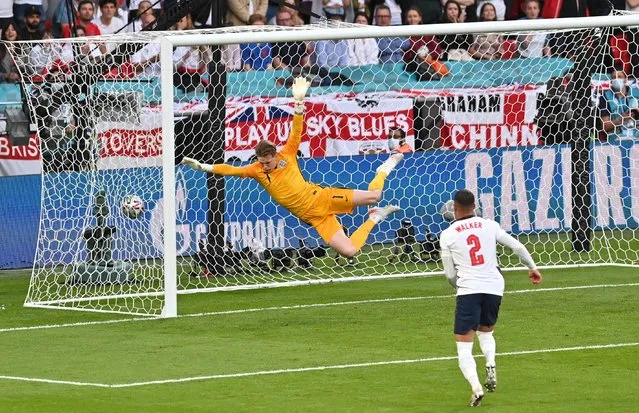 Jordan Pickford of England fails to save as Mikkel Damsgaard of Denmark (not pictured) scores their team's first goal from a free kick during the UEFA Euro 2020 Championship Semi-final match between England and Denmark at Wembley Stadium on July 07, 2021 in London, England. (Photo by Justin Tallis/Pool via Reuters)