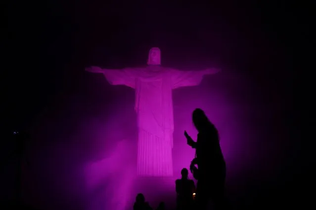 The statue of Christ the Redeemer is lit up in pink for the start of the national campaign “Pink October” to raise awareness for breast cancer in Rio de Janeiro, Brazil on October 3, 2023. (Photo by Pilar Olivares/Reuters)