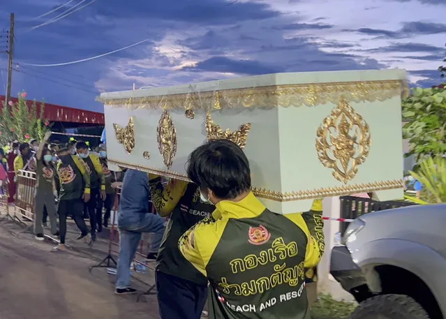 A handout photo made available by Ruamkatanyu Foundation shows Ruamkatanyu Foundation's rescue workers carrying a coffin for the mass shooting victims at a childcare center in Nong Bua Lamphu province, northeastern Thailand, 06 October 2022. According to Deputy National Police Chief Pol Lt Gen Torsak Sukvimol, at least 35 people, mostly children, were killed when a former policeman carried out a mass shooting at a children care center before killing himself, his wife and their child. (Photo by Ruamkatanyu Foundation/EPA/EFE)