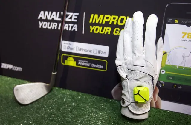 A Zepp sensor is shown on a golf glove during “CES Unveiled”, a media preview event to the annual Consumer Electronics Show (CES), in Las Vegas, Nevada, January 5, 2014. The sensors, available for golf, baseball and tennis, analyze 1,000 data points per second to create 3D representations of a player's swing, a representative said. The sensors retail for $149.99, he said. (Photoby Steve Marcus/Reuters)