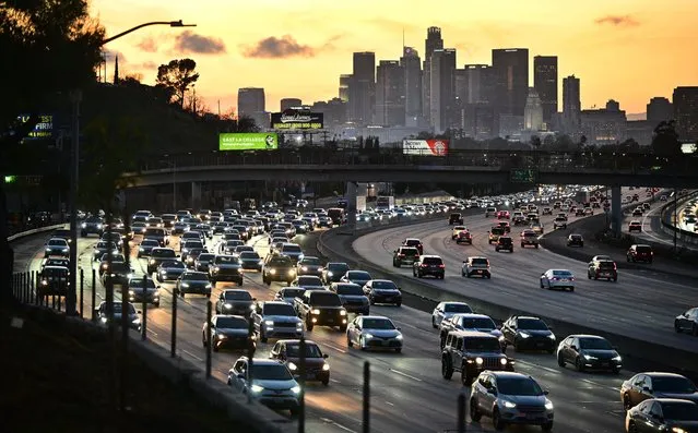Cars make their way heading east out of Los Angeles during the evening rush hour on January 25, 2024. California lawmaker State Senator Scott Wiener introduced on January 23, 2024 a bill requiring new passenger vehicles and large trucks sold in California have technology to prevent drivers from going more than 10 miles an hour above the speed limit in response to surging traffic deaths in the US. (Photo by Frederic J. Brown/AFP Photo)