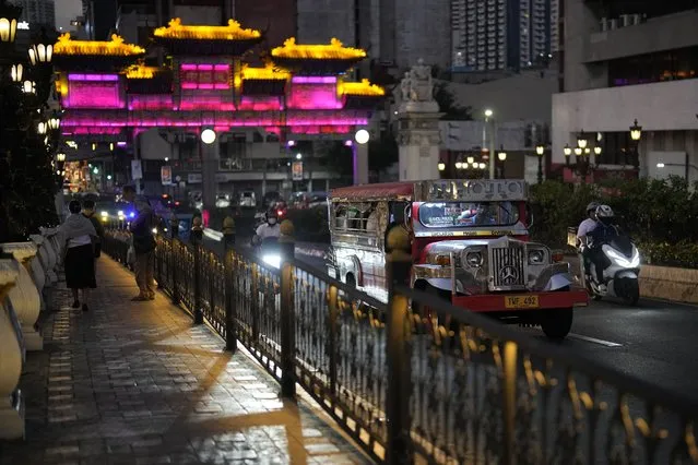 A passenger jeepney crosses the Jones Bridge at the edge of Binondo district, said to be the oldest Chinatown in the world, in Manila, Philippines on Monday, February 5, 2024. (Photo by Aaron Favila/AP Photo)