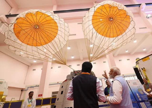 A handout photo made available by the Indian press information bureau showing Indian Prime Minister Narendra Modi (R) visiting the Vikram Sarabhai Space Centre in Thiruvananthapuram, Kerala, India 27 February 2024. Modi on 27 February was briefed by Indian Space Research Organization chief S Somnath on progress to send Indian astronauts into space and revealed the names of the four members for the country's first manned mission.  (Photo by Press Information Bureau/EPA)
