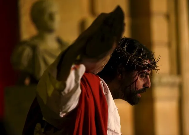 An actor portraying Jesus Christ takes part in the interactive street-theatre Passion play “Il-Mixja” (The Way), one of a series of Holy Week activities in the run-up to Easter, in the grounds of Mount Carmel Mental Hospital in Attard, outside Valletta, Malta, March 22, 2016. (Photo by Darrin Zammit Lupi/Reuters)