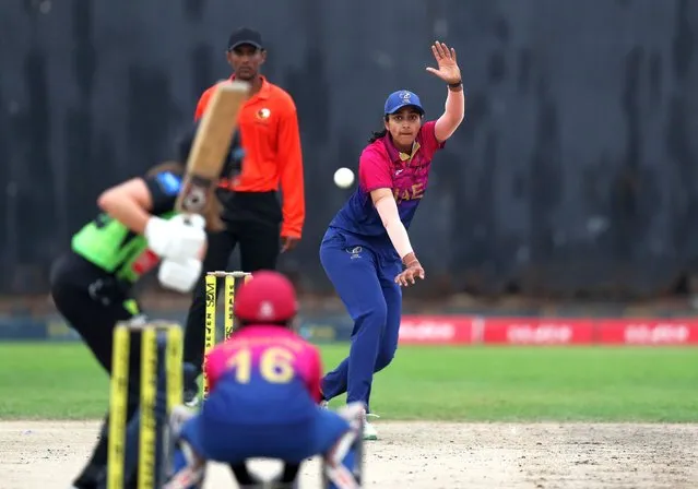 UAE captain Esha Oza bowls against English touring side Western Storm in a friendly at Malek Cricket Stadium in Ajman, United Arab Emirates on March 25, 2024. (Photo by Chris Whiteoak/The National)