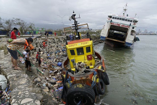 Ships run aground due to Typhoon Rai in Cebu city, central Philippines on Friday, December 17, 2021. (Photo by Jay Labra/AP Photo)