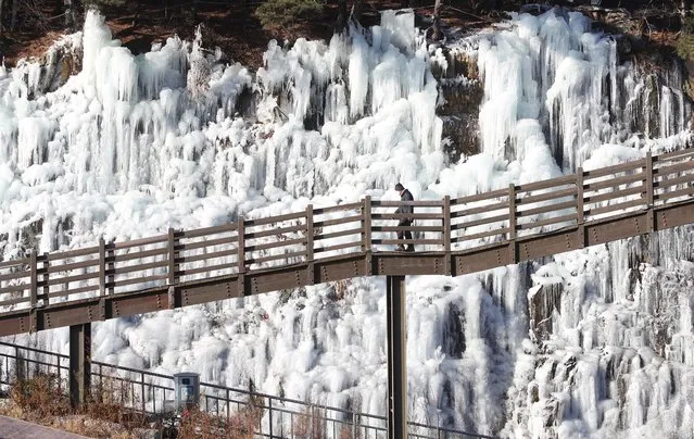A cold wave creates a giant ice wall at Songahe Park in Daegu, 300 kilometers southeast of Seoul, South Korea, 03 January 2022. (Photo by Yonhap/EPA/EFE)