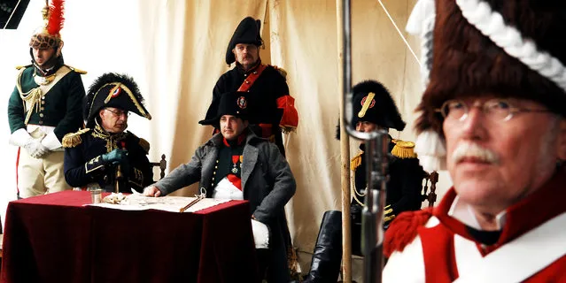 In this June 16, 2007,  file photo, actors dressed as soldiers re-enact the Battle of Waterloo in Braine-l'Alleud, near Waterloo, Belgium. The Battle of Waterloo, fought on June 18, 1815, was Napoleon Bonaparte's last battle, as his defeat put a final end to his rule as Emperor of France. (AP Photo/Geert Vanden Wijngaert, File)