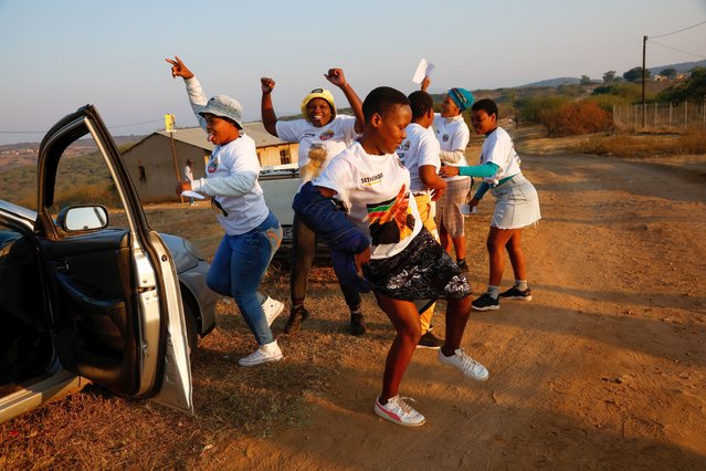 People dance near a polling station during the South African elections in Nkandla, South Africa on May 29, 2024. (Photo by Rogan Ward/Reuters)