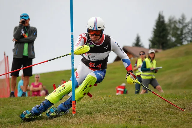 Switzerland's Vito Schnabel competes during the first run of the slalom event at the FIS Grasski World Championships in Marbachegg on August 17, 2019. The skis attached to the skiers' boots are short with rolling treads or wheels. (Photo by Stefan Wermuth/AFP Photo)