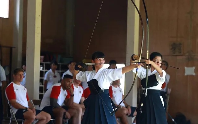 England players look on as students take part in the traditional art of Japanese archery, known as Kyudo, during the England team visit to Miyazaki Kita High School on September 11, 2019 in Miyazaki, Japan. (Photo by David Rogers/Getty Images)
