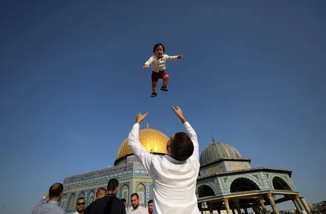 Palestinians celebrate on the first day of Muslim holiday of Eid al-Adha on the compound known to Muslims as Noble Sanctuary and Jews as Temple Mount, in Jerusalem's Old City on July 20, 2021. (Photo by Ammar Awad/Reuters)