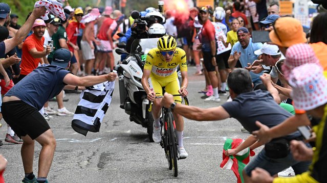 UAE Team Emirates team's Slovenian rider Tadej Pogacar cycles in the final kilometers of the Saint-Lary-Soulan Pla d'Adet ascent during the 14th stage of the 111th edition of the Tour de France cycling race, 151,9 km between Pau and Saint-Lary-Soulan Pla d'Adet, in the Pyrenees mountains in southwestern France, on July 13, 2024. (Photo by Bernard Papon/AFP Photo)