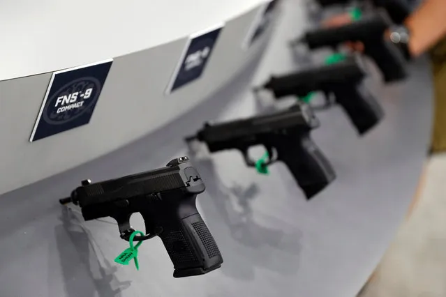 Guns are seen on display in the trade booths during the National Rifle Association's annual meeting in Louisville, Kentucky, May 21, 2016. (Photo by Aaron P. Bernstein/Reuters)