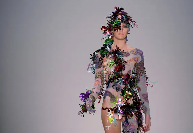 A model for the fashion label Ewol wears colourful headwear on the runway at Fashion Week Australia in Sydney on May 17, 2017. (Photo by Jason Reed/Reuters)