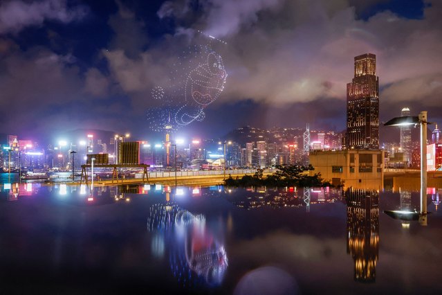 Approximately 1,000 drones illuminate the sky above Victoria Harbour during the Doraemon drone show in Hong Kong on July 20, 2024. (Photo by Tyrone Siu/Reuters)