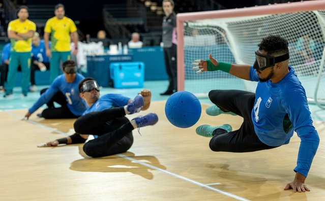 A handout photo made available by OIS/IOC shows Leomon Moreno Da Silva of Brazil dives to stop the ball during the Men’s Preliminary Round Pool A Game between USA and Brazil of the Goalball competitions in the Paris 2024 Paralympic Games, in Paris, France, 30 August 2024. (Photo by Adrian Dennis/EPA/EFE)