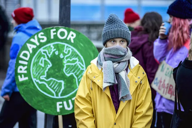 Swedish environmental activist Greta Thunberg attends a climate strike arranged by the organization “Fridays For Future” outside the Swedish parliament Riksdagen in Stockholm, Friday December 20, 2019. (Photo by Pontus Lundahl/TT via AP Photo)