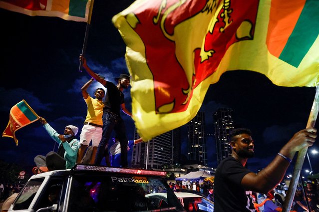 Demonstrators hold Sri Lankan national flags and shout slogans during a protest against Sri Lankan President Gotabaya Rajapaksa, near the Presidential Secretariat, amid the country's economic crisis, in Colombo, Sri Lanka, April 16, 2022. (Photo by Navesh Chitrakar/Reuters)