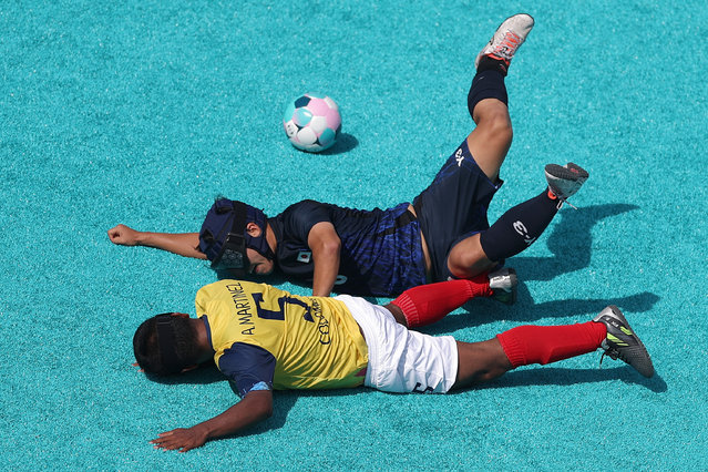 Taichi Hirabayashi of Team Japan and Alex Enrique Martinez Guevara of Team Colombia collide during a men's preliminary group B blind football match on day four of the Paris 2024 Summer Paralympic Games at Eiffel Tower Stadium on September 01, 2024 in Paris, France. (Photo by Steph Chambers/Getty Images)