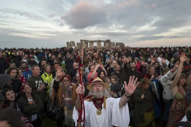 Revellers celebrate the summer solstice at Stonehenge on Salisbury Plain in southern England, Britain June 21, 2016. (Photo by Kieran Doherty/Reuters)