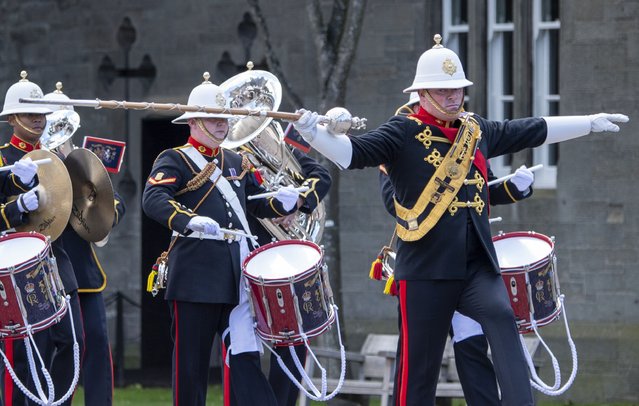 Members of the armed forces leaving the Palace of Holyroodhouse for the National Service of Thanksgiving and Dedication for King Charles III and Queen Camilla, and the presentation of the Honours of Scotland, in Edinburgh, Wednesday, July 5, 2023. (Photo by Lesley Martin/Pool photo via AP Photo)