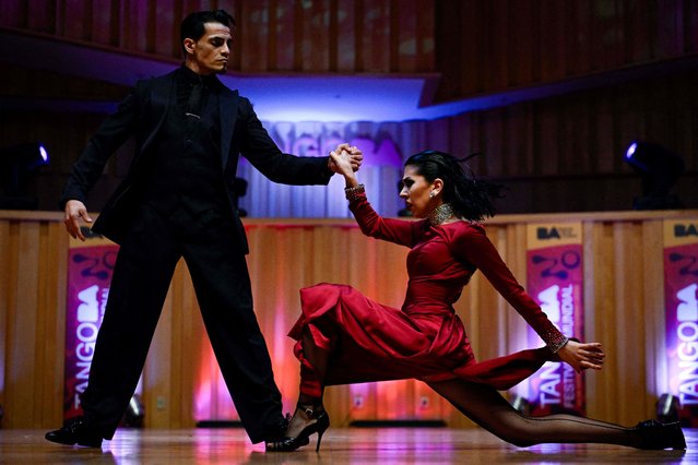 Ayelen Morando (R) and Sebastian Martinez compete during the World Tango Championship semifinal in the Tango Stage category in Buenos Aires on August 31, 2023. The Tango World Festival and Championship, which brings together thousands of Tango music lovers from different parts of the world every year, is being held in the Argentine capital Buenos Aires and runs until September 3. (Photo by Luis Robayo/AFP Photo)