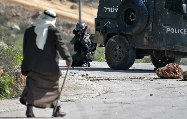 Israeli security forces keep position during clashes with Palestinian protesters in the village of Baita south of Nablus in the occupied West Bank on February 28, 2020. (Photo by Jaafar Ashtiyeh/AFP Photo)