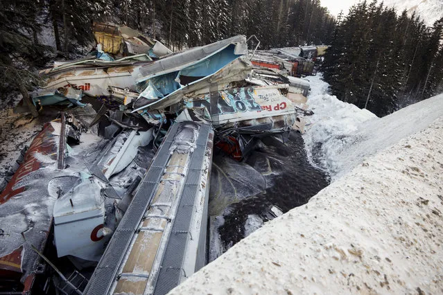 A train derailment is shown near Field, B.C., Canada on February 4, 2019. A union representative says a Canadian Pacific freight train fell more than 60 metres from a bridge near the Alberta-British Columbia boundary in a derailment that killed three crew members. The westbound freight jumped the tracks Monday at about 1 a.m. near Field, B.C. (Photo by Canadian Press/Rex Features/Shutterstock)