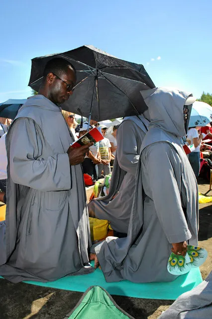 The faithful are seen during Pope Francis' visit in the the Sanctuary of John Paul II during the World Youth Day in Krakow, Poland, July 30, 2016. (Photo by Mateusz Skwarczek/Reuters/Agencja Gazeta)