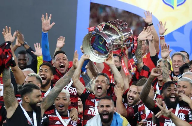 Flamengo's Diego celebrates with the trophy after winning the second leg match of the final of Copa do Brasil 2022 between Flamengo and Corinthians at Maracana Stadium on October 19, 2022 in Rio de Janeiro, Brazil. (Photo by Sergio Moraes/Reuters)