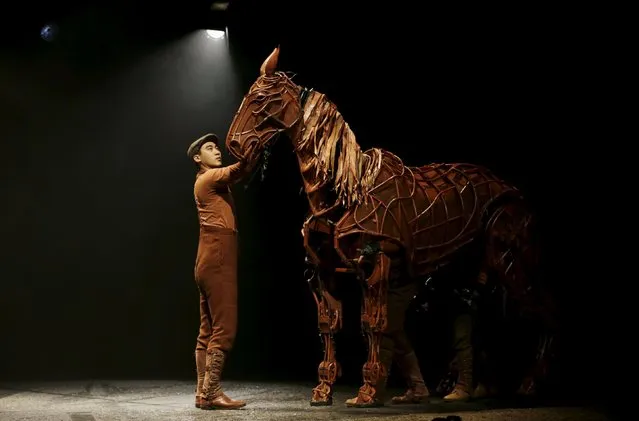 A Chinese actor holds the horse prop from the Chinese theatre production of British play “War Horse” during a performance for the UK-China Year of Cultural Exchange at National Theatre of China, in Beijing, September 20, 2015. (Photo by Jason Lee/Reuters)