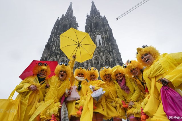 Revellers arrive in front of the Cologne Cathedral for the start of the street carnival in Cologne, Germany, Thursday, February 8, 2024. Hundreds of thousands will celebrate the carnival in the streets of the German carnival capital. (Photo by Martin Meissner/AP Photo)