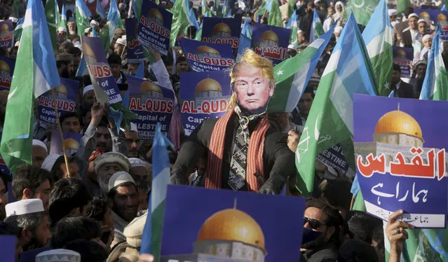 Supporters of Jamaat-e-Islami take part in an anti-American rally to condemn U.S. President Donald Trump for declaring Jerusalem as Israel's capital, in Peshawar, Pakistan, Friday, December 22, 2017. (Photo by Mohammad Sajjad/AP Photo)