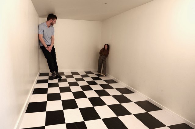 Visitors experiment an illusion at the World Of Mind WOM museum, dedicated to the five senses, the human perceptions and the illusions in Brussels, Belgium on February 6, 2024. (Photo by Yves Herman/Reuters)