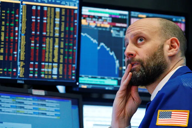 A trader reacts as he watches screens on the floor of the New York Stock Exchange in New York, U.S., February 5, 2018. (Photo by Brendan McDermid/Reuters)