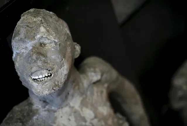 The[ plaster cast of a Pompeii victim lies in a frescoed room in the ancient Roman city, Pompeii, October 13, 2015. (Photo by Alessandro Bianchi/Reuters)