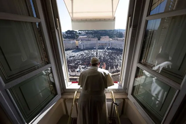 Pope Francis leads the Angelus prayer from his window at the Vatican on January 29, 2023. (Photo by Vatican Media/Handout via Reuters)