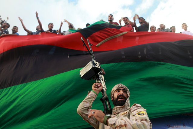 One of the members of the military protecting a demonstration against candidates for a national unity government proposed by U.N. envoy for Libya Bernardino Leon, is pictured in Benghazi, Libya October 23, 2015. (Photo by Esam Omran Al-Fetori/Reuters)