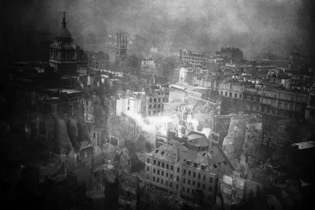 A striking view, taken from the roof of St. Paul's Cathedral in London January 3, 1941, showing how the famous building was ringed by fires on the night of the Great “Blitz”. Devastated buildings are seen everywhere, with the tower of the Old Bailey, surmounted by its Statue of Justice, still standing top left. (Photo by AP Photo)