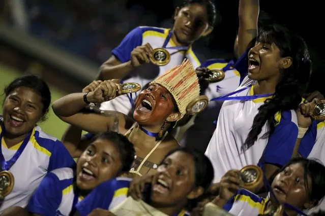 Indigenous women from the Xerente tribe of Brazil celebrate after a soccer match against an indigenous team from Bolivia in the I World Games for Indigenous People in Palmas, Brazil, October 30, 2015. (Photo by Ueslei Marcelino/Reuters)