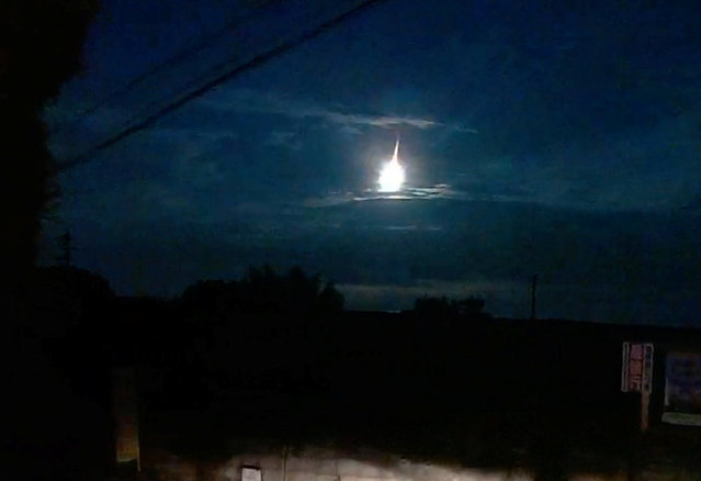 A fireball streaks across the sky, as seen from Kumamoto, Kyushu, Japan, on August 19, 2025. The celestial display resulted from a very bright meteroite falling to Earth. (Photo by MARUPEKE/@MARUBATU7 via Reuters)