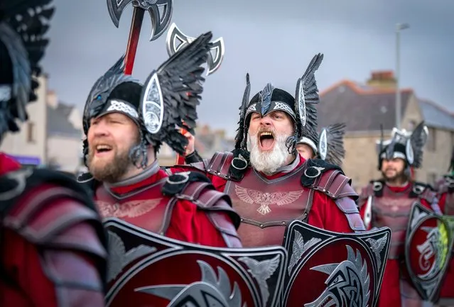 Members of the Jarl Squad and their galley at the harbour in Lerwick on the Shetland Isles during the Up Helly Aa festival on Tuesday, January 31, 2023. Originating in the 1880s, the festival celebrates Shetland's Norse heritage. (Photo by Jane Barlow/PA Images via Getty Images)