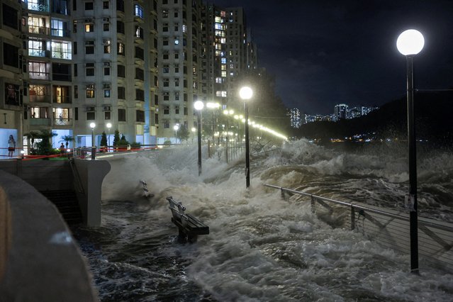 Waves from Super Typhoon Ragasa crash onto chairs by the shore in Hong Kong, China, on September 23, 2025. (Photo by Tyrone Siu/Reuters)
