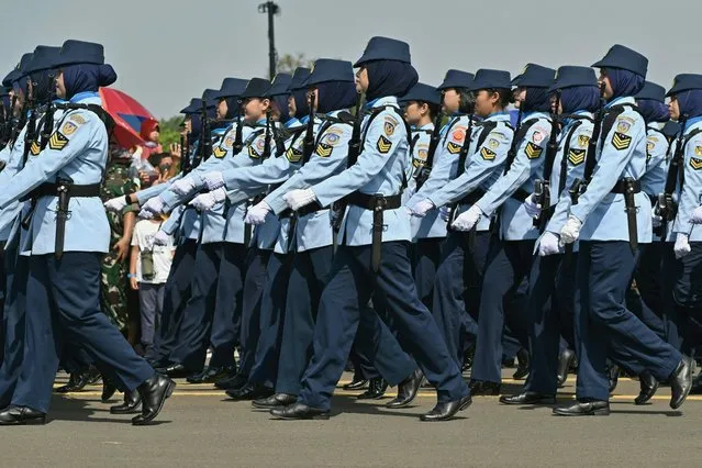 Indonesia's Air Force soldiers take part in a parade to mark the 77th anniversary of the Indonesian Air Force at the Halim Perdanakusuma airport in Jakarta on April 9, 2023. (Photo by Adek Berry/AFP Photo)