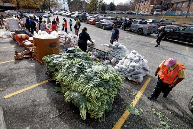 Volunteers prepare and distribute bags of food during the 'Thanksgiving Turkey Giveaway' for needy families in Atlanta, Georgia, USA, 19 November 2025. Sponsored by Atlanta City Councilman Michael Julian Bonds and others, recipients received bags of food, including a frozen turkey, fresh produce and other items, at a time when underserved people are still reeling from the US government shutdown, including partial SNAP benefits. (Photo by Erik S. Lesser/EPA)