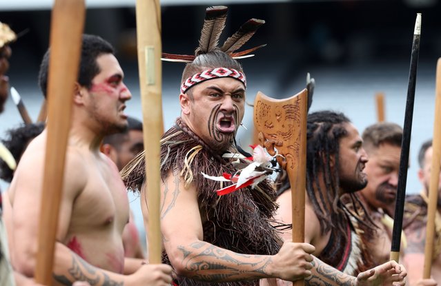 Maori men perform a haka as the casket of late New Zealand All Blacks rugby legend Jonah Lomu is carried onto Eden Park during a memorial service in Auckland on November 30, 2015. Lomu's career was cut short by a chronic kidney disease and he died unexpectedly at his Auckland home on November 18 aged just 40, leaving a wife and two young sons. (Photo by Michael Bradley/AFP Photo)