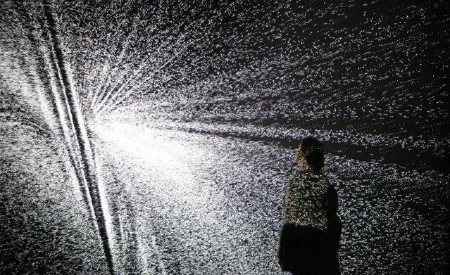 A visitor looks at an installation by artist Ryoji Ikeda at the Big Bang Data exhibition at Somerset House on December 2, 2015 in London, England. (Photo by Peter Macdiarmid/Getty Images for Somerset House)